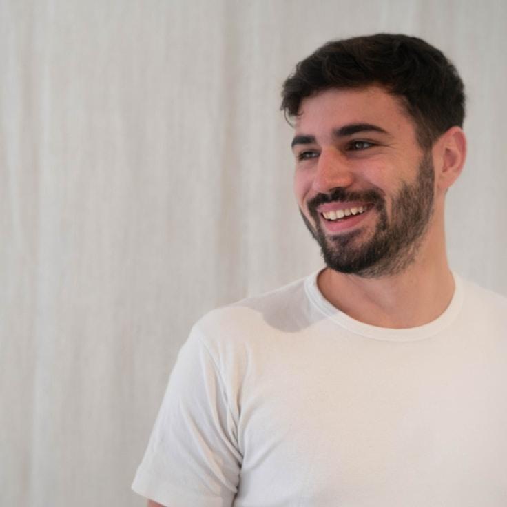 Kaveri Mehta, Lead Design Curator at SunsetOrchardGrove, reviewing corporate floral arrangements